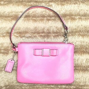 Vintage pink Coach wristlet with bow detail